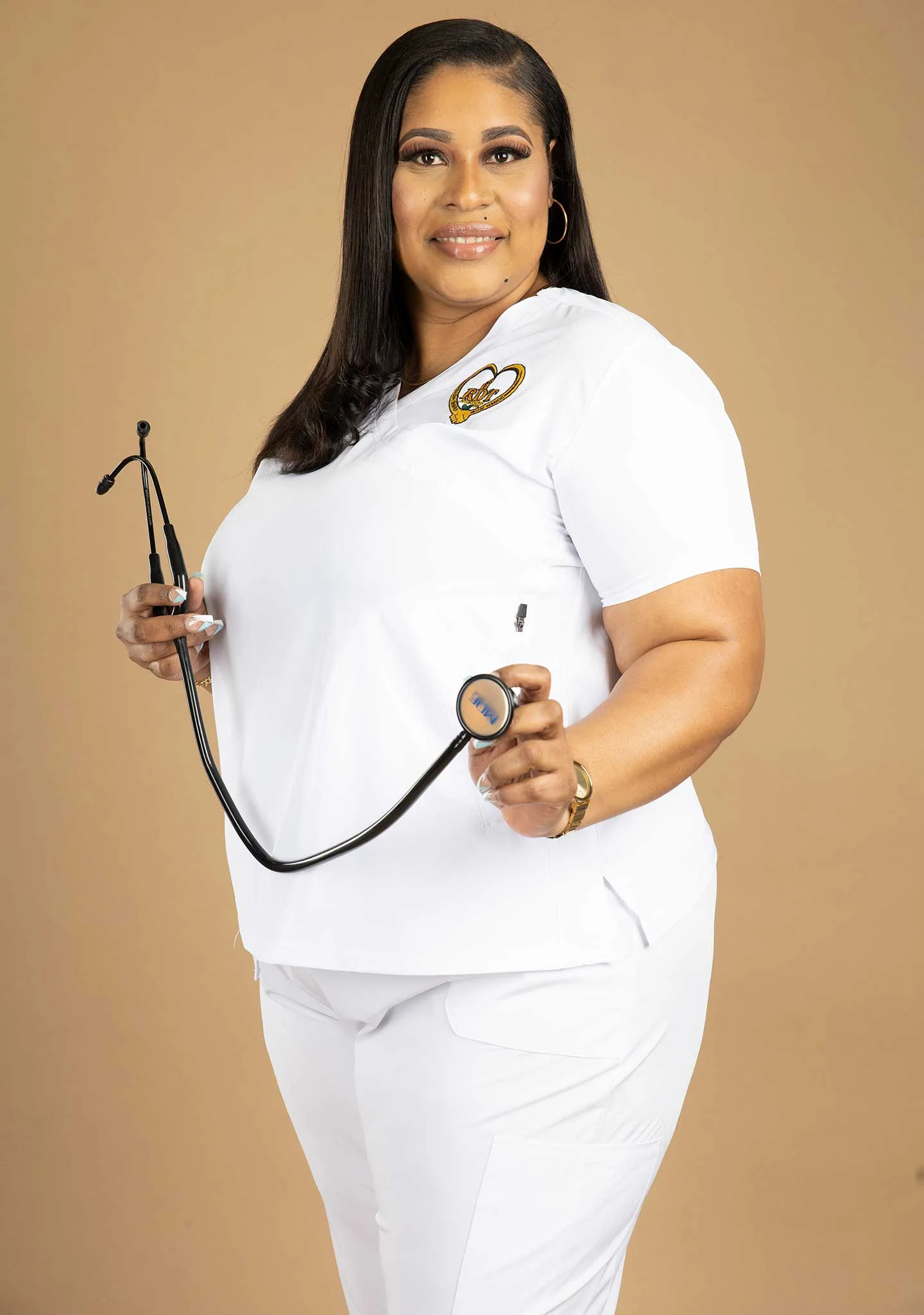 Roxanne McGann, founder of RDT Care Services, holding a stethoscope